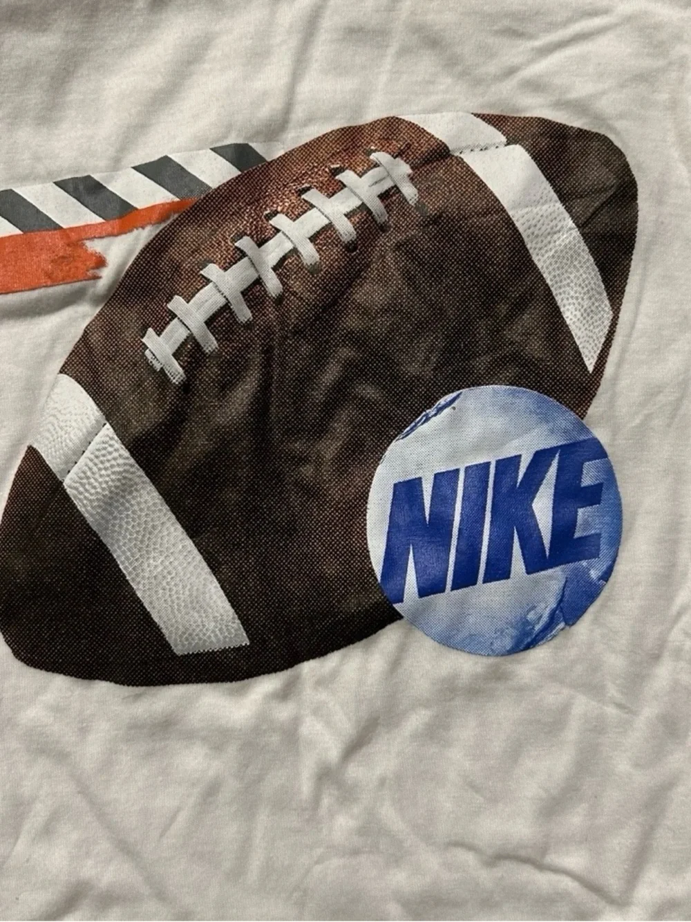 Nike White Tee with Brown Football and Blue Logo